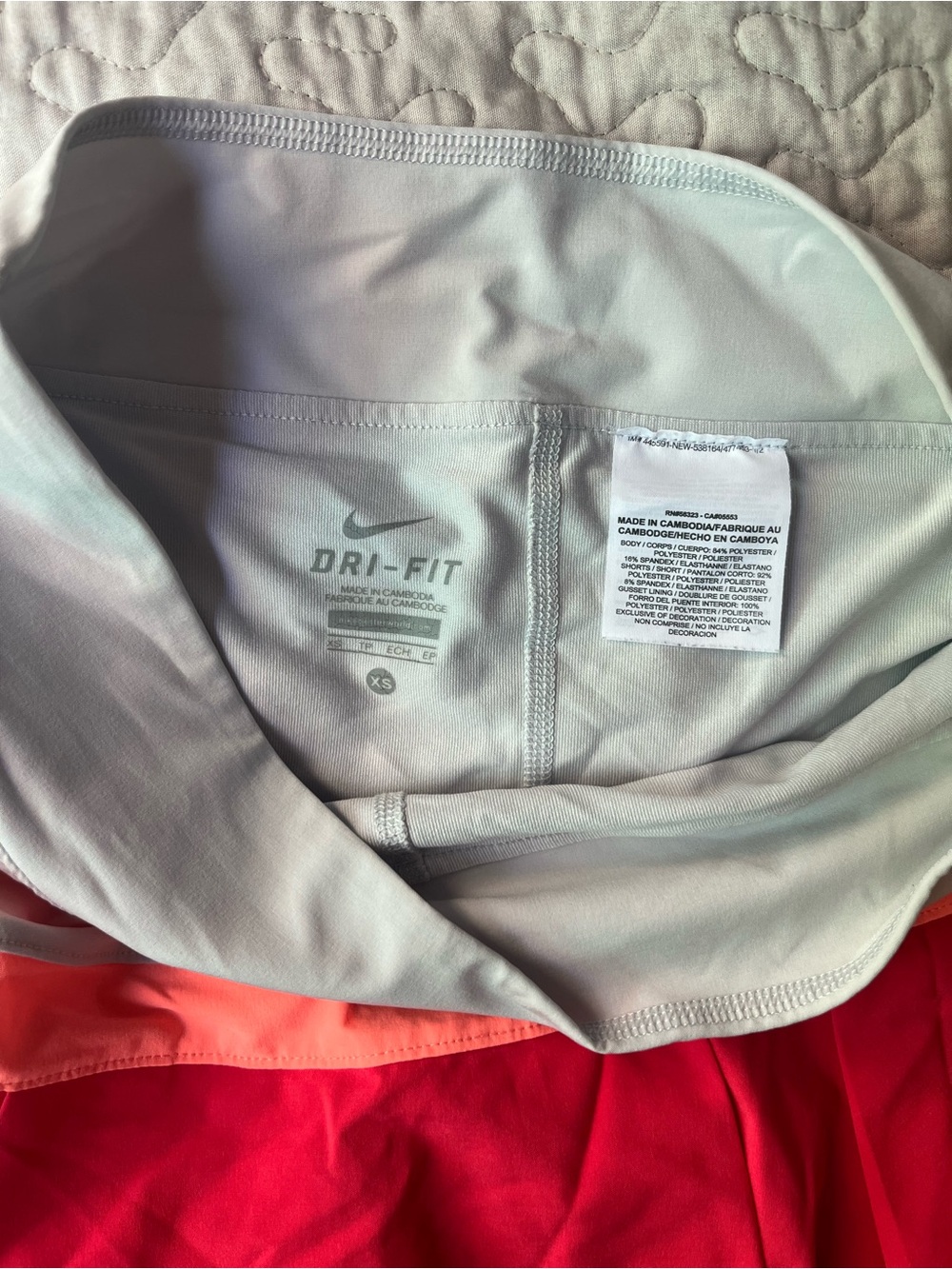 Nike Dri-Fit Women's Red Tennis Skort with Light Gray Waistband and Coral Trim - Picture 4 of 5